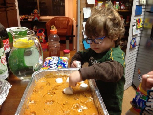 Image of Dana's son making the sweet potatoes.