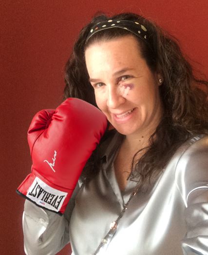 Dana with a black eye and boxing gloves
