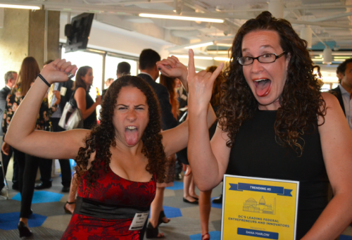 Sharon and Dana making silly faces and poses with her award