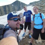 Ryan in Colorado with his family atop a snowy mountain